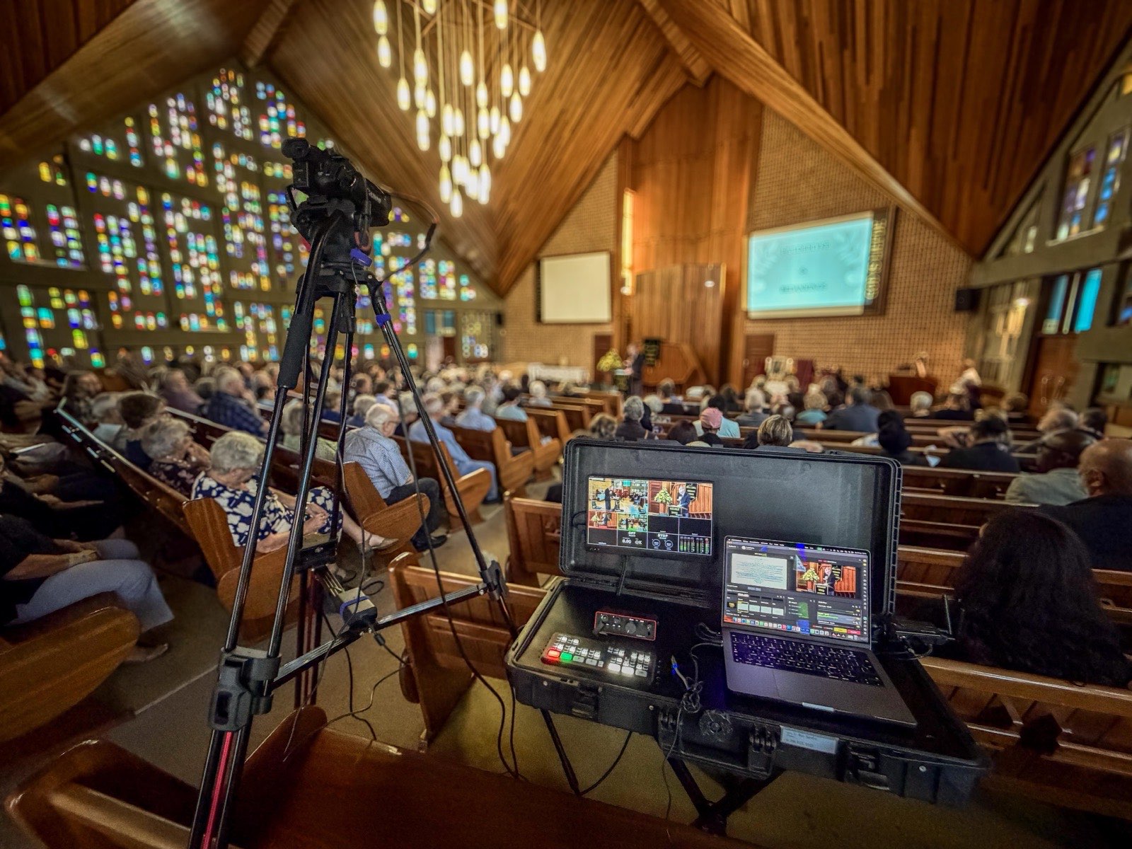 Live broadcast setup in stained glass cathedral